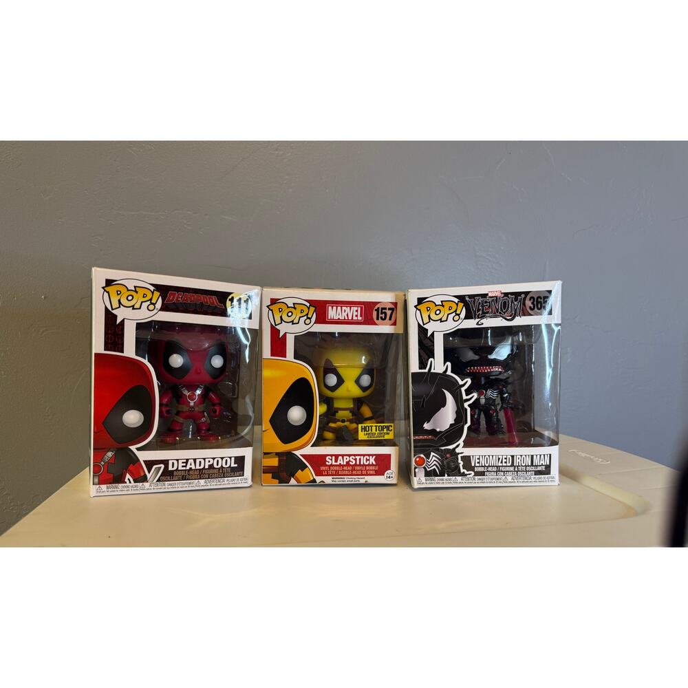 Marvel-themed Funko Pop! Deadpool;Hot Topic Exclusive Slapstick; venom Iron Man.